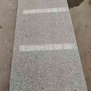 柳州芝麻白光面毛板